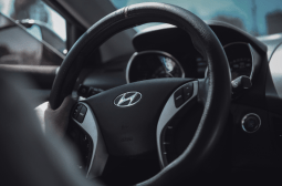 Close-up of a Hyundai steering wheel inside a vehicle, highlighting transmission service expertise.